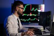 © Serhii - Financial Analyst Working on a Computer with Multi Monitor Workstation with Real Time Stocks