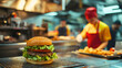© URRMInc - A fast-food worker in a red and yellow uniform stands behind the counter, efficiently preparing a burger with fresh lettuce and tomato, while the busy kitchen staff moves quickly in the background.