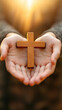 © Svetlanamax - Hands holding wooden cross in Easter morning light