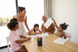 © ADDICTIVE STOCK - Family Enjoying Creative Time Together at Home