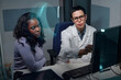 © pressmaster - Doctor in white coat showing medical results on computer to patient during consultation in hospital office. Medical professional engaging with the patient in a focused conversation