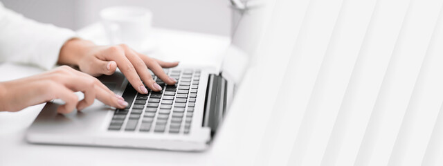 Poster - Job Search. Side view of unrecognizable lady using laptop, finding work projects online. Selective focus, empty space