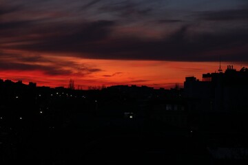 Wall Mural - view of beautiful sky over city at sunset