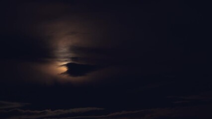 Wall Mural - mysterious full moon. clouds obscure the moon. night of lunar eclipse. shot from the area of ​​rai h