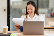 © David - Business asian woman hands working in Stacks of paper files for searching and checking unfinished document achieves on folders papers at busy work desk office