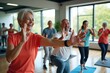© Paull - an adult is exercising happily in a fitness center.
