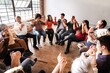 © Rawpixel.com - Diverse group in a circle holding hands, showing unity and connection, sharing a moment of togetherness and community. Diverse people sitting in a circle of support from community.