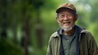 © Valua Vitaly - Handsome Asian elderly man smiling in the park. Portrait of senior Japanese man smiling at camera outdoors. Good looking happy senior Chinese grandfather walking in a garden. .