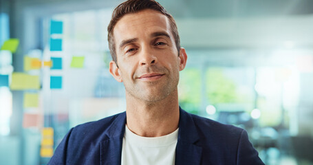 Fototapete - Portrait, smile and business man in office, employee and happy creative writer. Face, confident worker and entrepreneur, professional and magazine editor by glass wall with sticky note in startup
