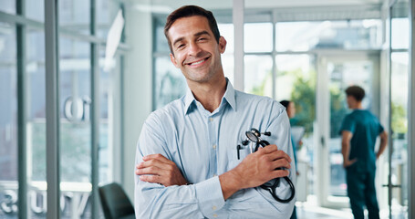 Fototapete - Doctor, man and arms crossed with stethoscope at hospital for medical service, about us and healthcare worker. Medicine portrait, physician and confidence for health treatment, pride and clinic care