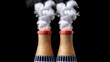 © Suttiwan - Cooling towers emitting steam against black background, showcasing industrial energy production
