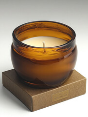 Poster - beautifully crafted amber glass candle sits atop stylish box, exuding warmth and elegance. soft glow of candlelight creates cozy atmosphere, perfect for relaxation