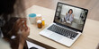 © Natee Meepian - Telemedicine and Virtual Consultation. A patient participating in a telehealth appointment with a healthcare professional via laptop.