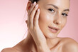 © Cavan Images - Pretty woman with natural beauty posing over pink background