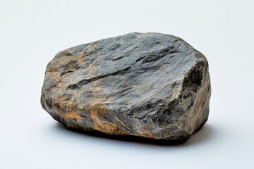 Aufkleber - A single, dark gray and brown boulder with rough texture sits on a white background.