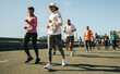 © Jacob Lund - Pair of female runners leading a marathon race on sunny day