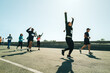 © Jacob Lund - Group of runners celebrating achievement during a race