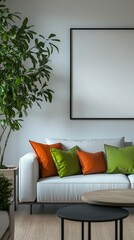 Poster - A spacious living room showcases a white sofa adorned with green and orange cushions. A tall plant adds a touch of nature against the clean, neutral walls, enhancing the calm atmosphere