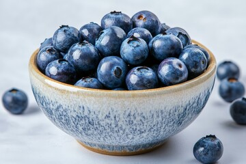 Poster - Bowl of fresh blueberries surrounded by scattered berries for healthy eating and cooking
