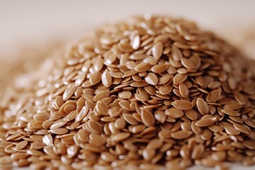 Poster - Brown flaxseeds are piled together on a smooth surface showcasing their shiny exterior and healthy appeal