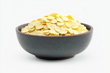 Poster - Bowl filled with golden corn flakes placed on a white background for breakfast preparation or food styling