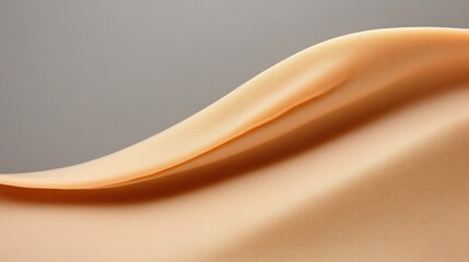Poster - A delicate peach-colored fabric flows gracefully, highlighting its soft texture and gentle undulations, illuminated by soft ambient light