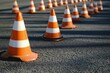 © Nadiatul - traffic cones on the asphalt floor in line for driving school