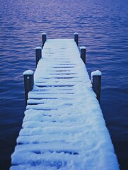 Wall Mural - snowy pier over water