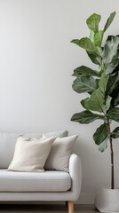 Poster - Soft textures and natural greenery create a welcoming ambiance in this minimalist living space. The light-colored sofa pairs perfectly with the vibrant plant, inviting relaxation