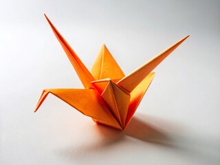 Poster - Fisheye View of Orange Origami Crane on White Background - Creative Food Photography