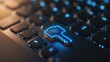 © Rakyandani - Close-up of a glowing blue key symbol on a dark keyboard, highlighting digital security and technology themes