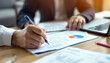 © adiba sakila atmari - Businesspeople Analyzing Financial Data Together