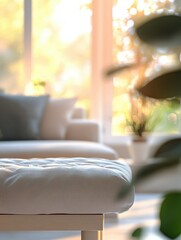 Poster - Blurred view of light living room with sofa and soft bench; unfocused background photo; selective focus