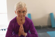 © WavebreakMediaMicro - Senior woman practicing yoga with eyes closed, focusing on meditation and balance