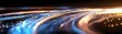 © Yuliia - Abstract curved light trails in blue and orange colors against dark background creating dynamic motion effect with glowing bokeh and streaks for technology concept.