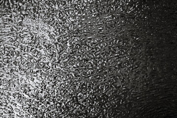 Poster - A black and white photo of a frosty surface.