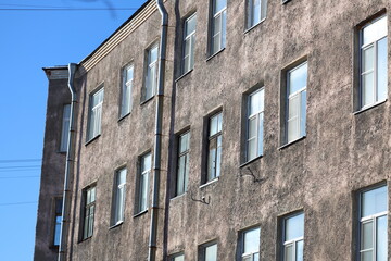 Poster - A modern building with a clock tower, suitable for use in architecture or cityscape images.