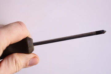 Aufkleber - A person holding a pen with a black handle, perfect for illustrations and designs.
