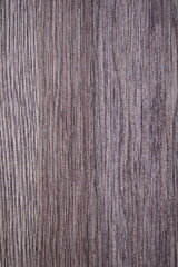 Poster - A close-up shot of a wooden table with a knife and fork, perfect for rustic or nature-inspired settings.