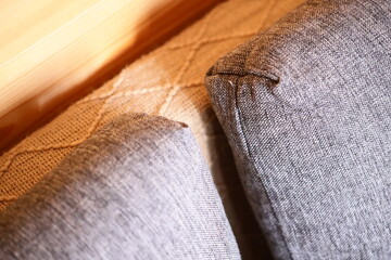 Aufkleber - Close-up shot of a couch with a pillow in focus.
