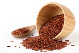 Red Mapillai Samba Rice Spilling from Wooden Bowl with Spoon, Ideal for Food Photography or Healthy Eating Themes, Featuring Natural Texture and Nutritious Grain, Isolated Shot