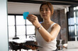 © Wavebreak Media - Businesswoman placing sticky note on glass wall while holding tablet in office