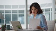 © stockbusters - Fatigued businesswoman reading document feeling overloaded at office closeup