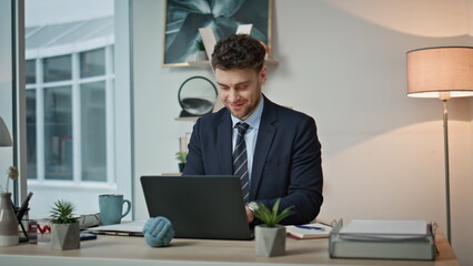Poster - Office worker feeling success working on laptop at workplace smiling closeup. 