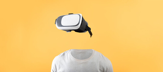 Poster - A user utilizes a virtual reality headset with no visible head or face against a bright yellow background. This setup highlights cutting-edge technology for immersive experiences.