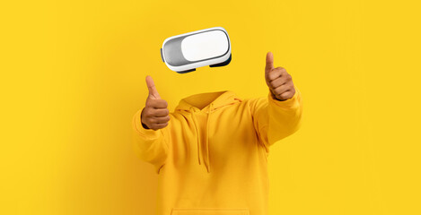 Poster - In a vibrant yellow background, a user wearing modern virtual reality goggles gives a thumbs up, showcasing excitement for the immersive experience offered by the device.