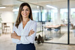© insta_photos - Confident middle aged business woman attorney, 45 years old lady entrepreneur, mature female professional executive manager leader standing in modern company office looking at camera. Portrait.
