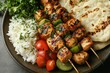 © kenzie - Grilled Chicken Skewers with Rice, Naan, and Veggies on a Plate