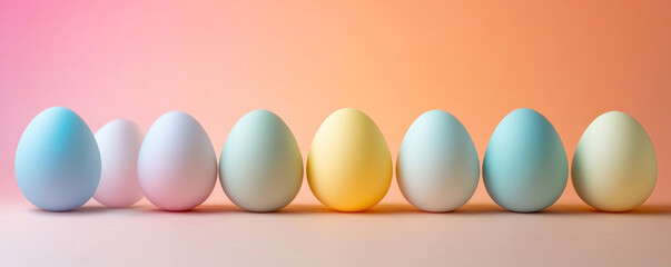 Poster - A row of colorful eggs are lined up on a pink background. The eggs are of different colors, including blue, yellow, and pink. The arrangement of the eggs creates a sense of harmony and balance