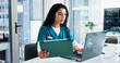 © peopleimages.com - Woman, nurse or reading with laptop or tablet for medical research, discovery or study at hospital. Female person, healthcare worker or employee with technology for telehealth or health app at clinic